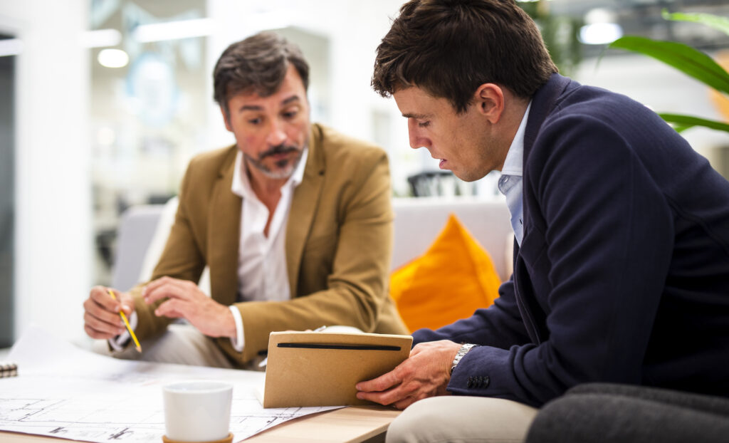 low angle male coworkers planning sketches 1024x622